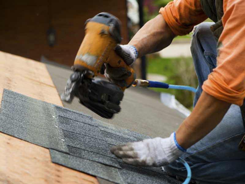 roof shingles being installed 